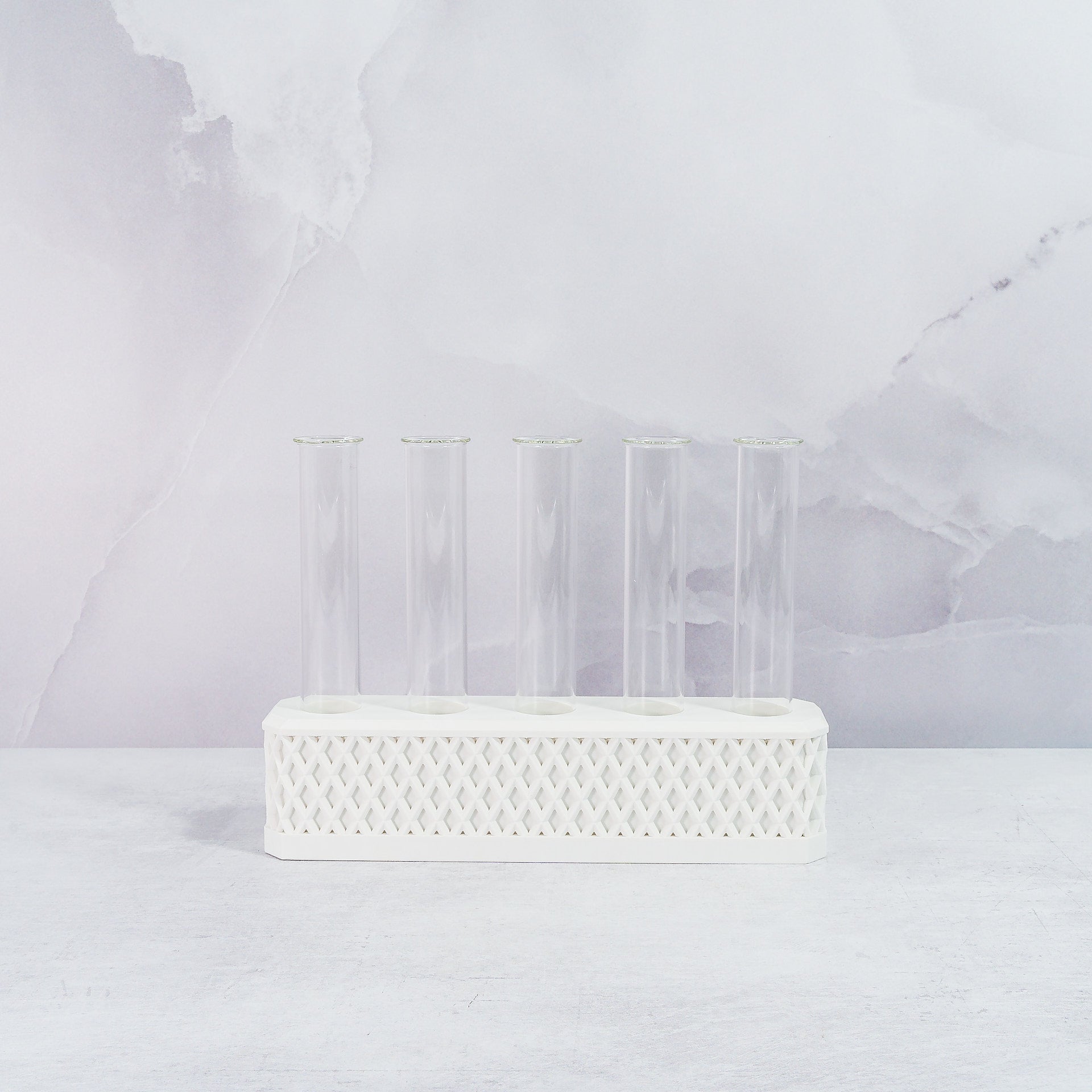 "Front view of empty MATTE WHITE Propagation Station, featuring five clear tubes in a sleek, minimalist white block."
