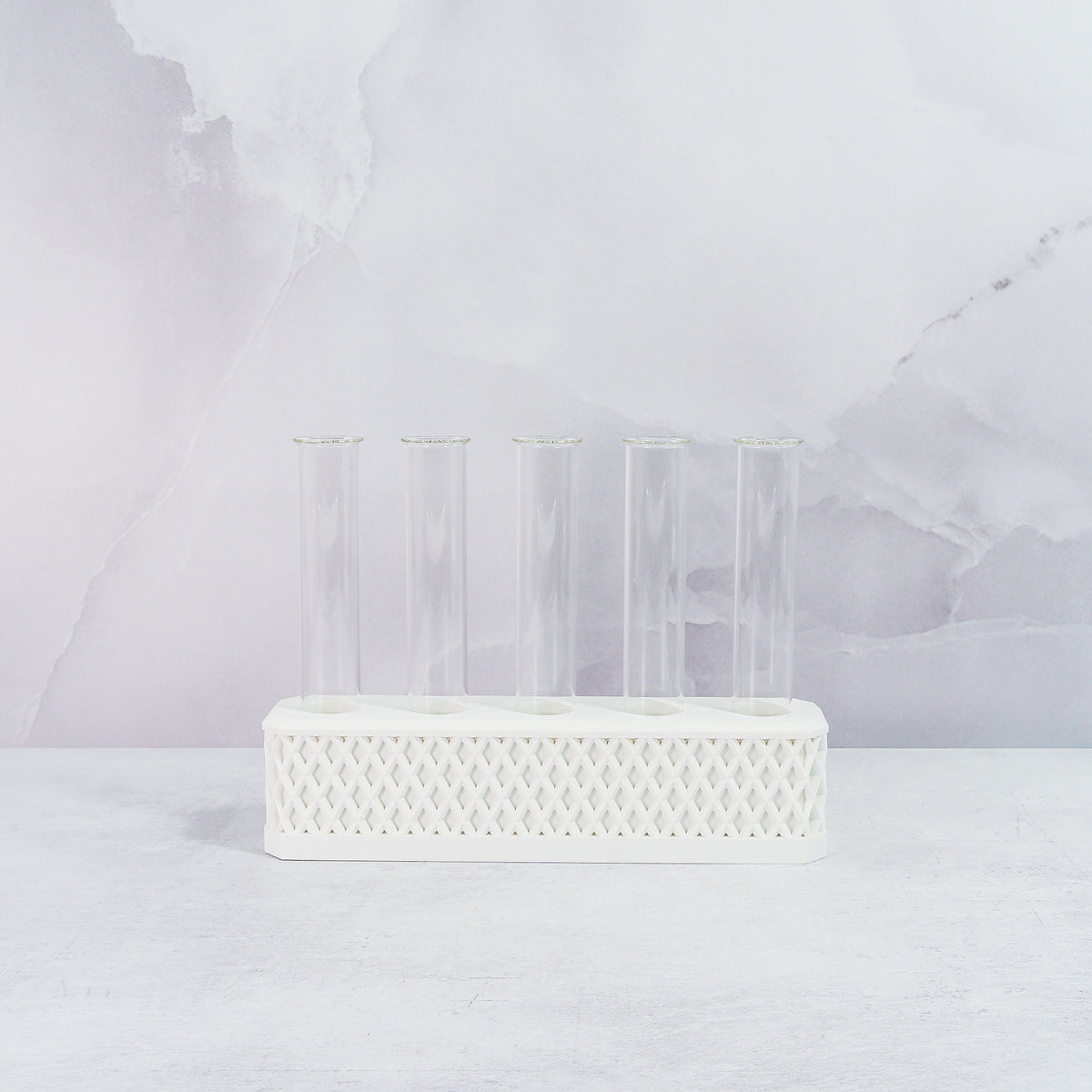 "Front view of empty MATTE WHITE Propagation Station, featuring five clear tubes in a sleek, minimalist white block."
