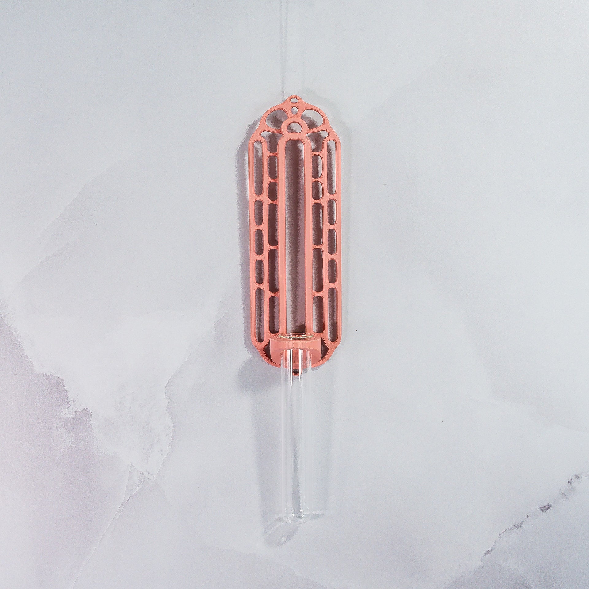 "Front view of empty CLAY RED Wall Propagation unit, showcasing a single clear tube mounted on a vibrant clay red base."
